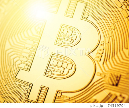 Macro shot of golden Bitcoin coin Macro shot of golden Bitcoin coin 74519704