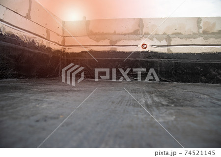 the terrace is covered with a layer of waterproofing roofing material the terrace is covered with a layer of waterproofing roofing material 74521145