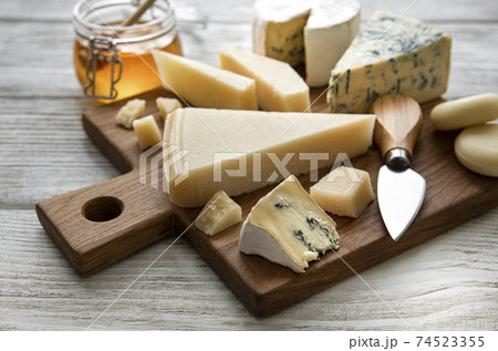 Various types of cheese  on a white wooden  background 74523355