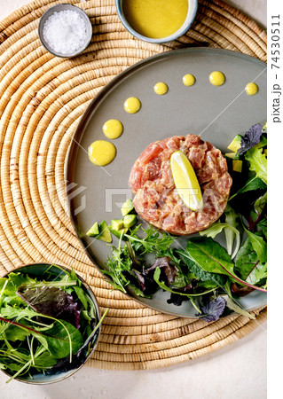 Tuna tartare with green salad Tuna tartare with green salad 74530511