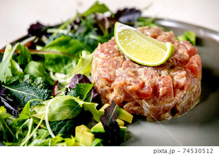 Tuna tartare with green salad Tuna tartare with green salad 74530512