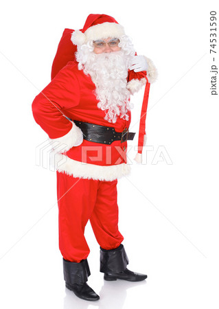 Santa Claus carrying big bag. Isolated on white background. Full length portrait 74531590