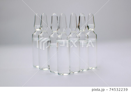 Medical ampoules for injection isolated on white background. Medicines and disease treatment, pharmacology and science concepts 74532239