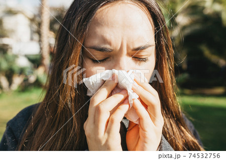 The woman blows her nose The woman blows her nose 74532756