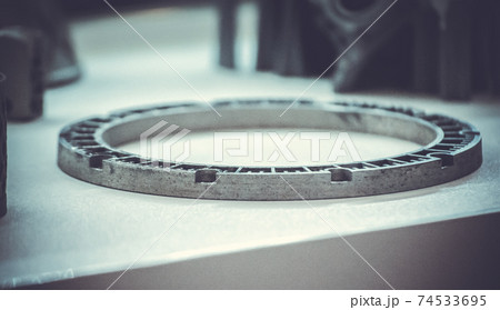 Man is holding object printed on metal 3d printer. 74533695