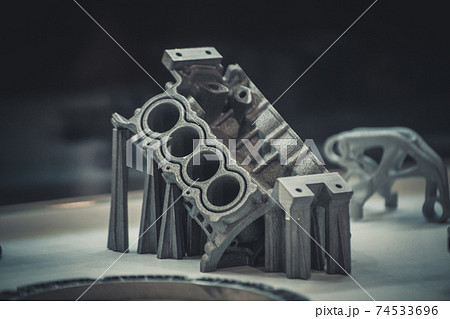 Man is holding object printed on metal 3d printer. 74533696