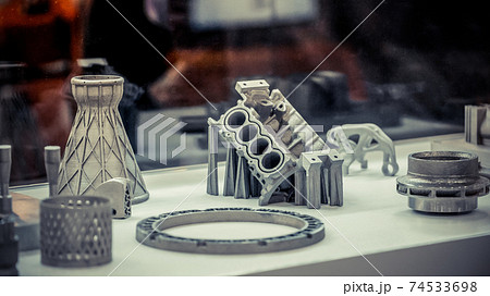 Man is holding object printed on metal 3d printer. 74533698