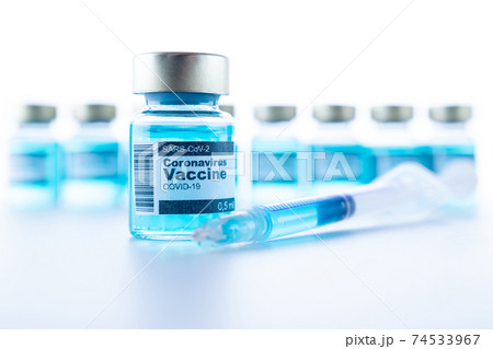 Medical needle bottles. Medical syringe with needle for protection flu virus and coronavirus. Covid vaccine isolated on white. Health care in hospital. 74533967