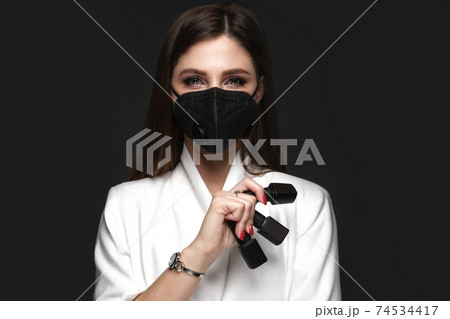 Manicurist in working form with tools in hand. Nail photo content 74534417