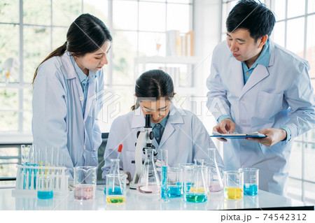 Medical researchers working in lab 74542312