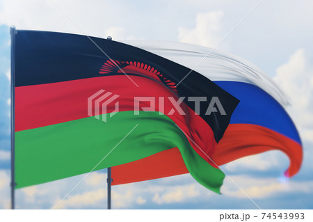 Waving Russian flag and flag of Malawi. Closeup view, 3D illustration. 74543993