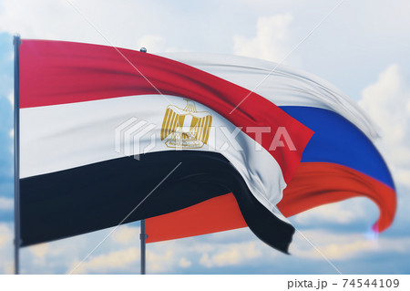 Waving Russian flag and flag of Egypt. Closeup view, 3D illustration. 74544109