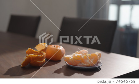 tangerine on walnut wood table indoor tangerine on walnut wood table indoor 74545758
