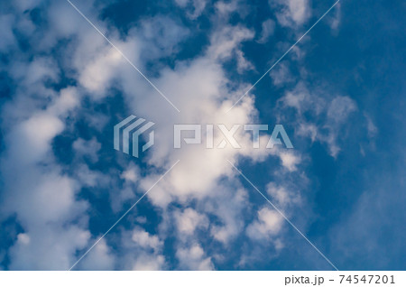 White translucent cloud against blue sky. Outdoors.  74547201