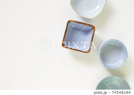 Colorful empty plates on white background. flat lay, top view, copy space 74548194