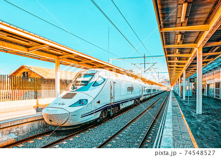 North Railways Station and modern hi-speed passenger train of Sp North Railways Station and modern hi-speed passenger train of Sp 74548527