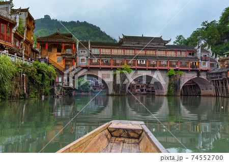 Fenghuang, China - May 30, 2018: Boat trip in the ancient town Fenghuang in Hunan 74552700