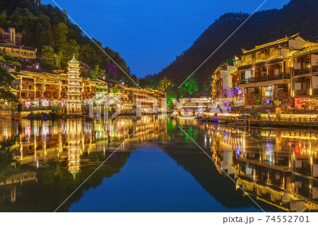 Fenghuang, China - May 29, 2018: Ancient town Fenghuang at sunset in Hunan Fenghuang, China - May 29, 2018: Ancient town Fenghuang at sunset in Hunan 74552701