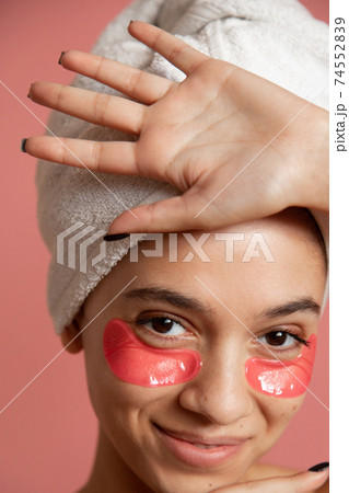 Woman standing isolated over pink background 74552839