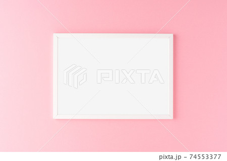Empty photo frame hanging on pink wall. Mockup Empty photo frame hanging on pink wall. Mockup 74553377