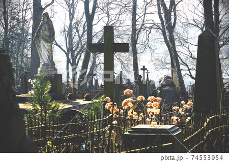 Old cemetery with grave stones and crosses in spring Old cemetery with grave stones and crosses in spring 74553954