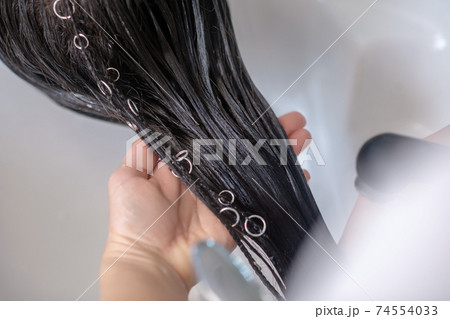Close up picture of long hair covered with keratin Close up picture of long hair covered with keratin 74554033