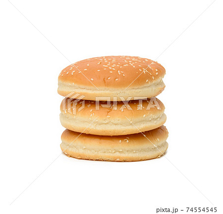 stack of baked round burger buns isolated on white background stack of baked round burger buns isolated on white background 74554545