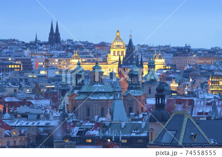 Prague - Spires of the Old town and illuminated National museum. 74558555