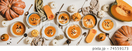 Flat-lay of seasonal fall pumpkin cream soup 74559173