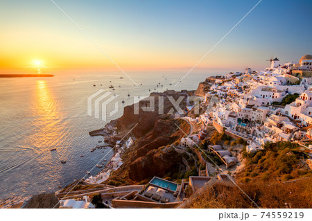 Sunset view of traditional Greek village Oia on Santorini island in Greece 74559219