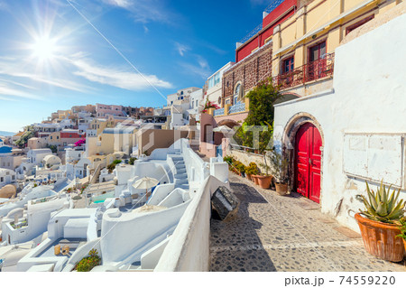 Famous Oia, Santorini, Greece. A picturesque view of the traditional Santorini  houses on a small street 74559220
