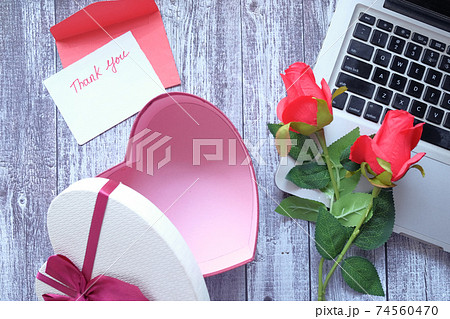 thank you message, envelope , gift box and flower on wooden table  74560470