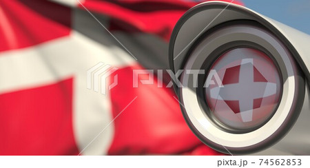 Surveillance camera and flag of Denmark. National security system concept. 3D rendering Surveillance camera and flag of Denmark. National security system concept. 3D rendering 74562853