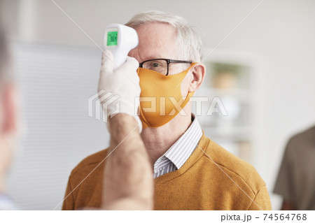 Senior Man at Safety Check in Clinic 74564768