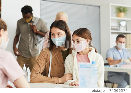 Family Registering at Vaccination Center Family Registering at Vaccination Center 74566574