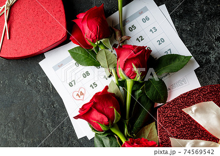 Valentine day. Red hearths and roses on Calendar page. February 14 of Saint Valentines day. Pink background. 74569542