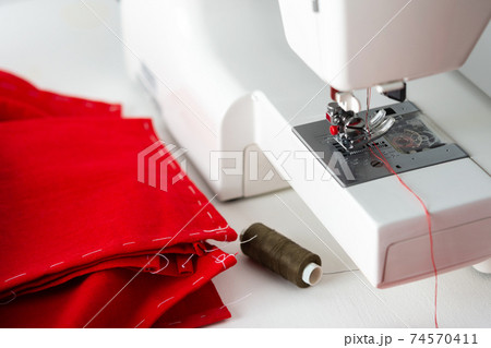 Sewing machine with red fabric 74570411