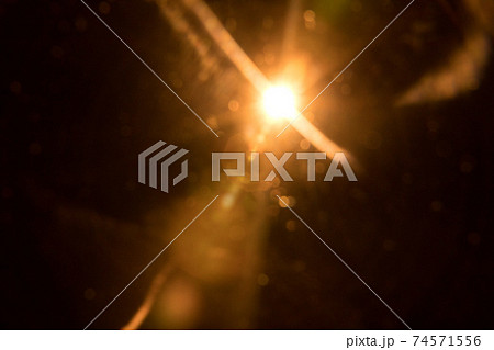 Abstract Natural Sun flare on the black 74571556