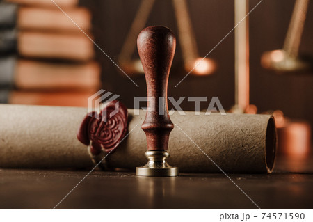 Last will and old wax seal close-up in notary office Last will and old wax seal close-up in notary office 74571590