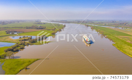 Cargo barge River Lek aerial view 74573179