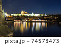 Pargue charles bridge and prague castle by night reflections river 74573473