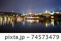 Pargue charles bridge and prague castle by night reflections river 74573479