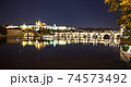 Pargue charles bridge and prague castle by night reflections river 74573492