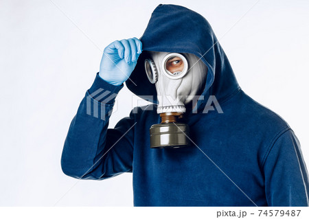 Portrait of a man in a gas mask. Panic during quarantine. Coronavirus pandemia 74579487
