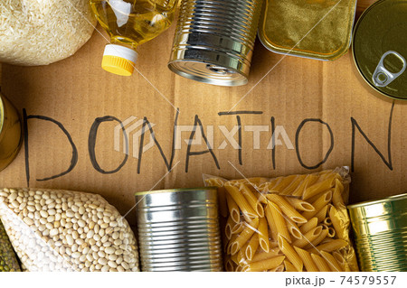 Food donations on the table. Text Donation. 74579557