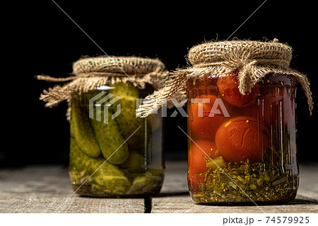 Jars with variety of pickled vegetables. Close up. Jars with variety of pickled vegetables. Close up. 74579925