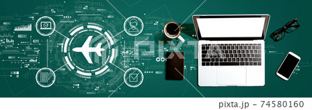 Flight ticket booking concept with a laptop computer Flight ticket booking concept with a laptop computer 74580160
