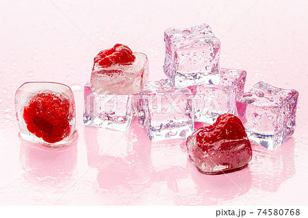 Ice cubes with berry for summer cocktails 74580768