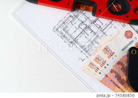 Architectural drawing and Russian Ruble money stack Architectural drawing and Russian Ruble money stack 74580850
