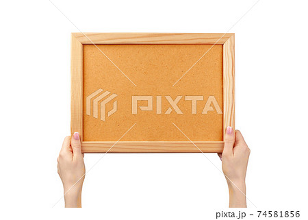 Female hands holding photo frame isolated on white 74581856